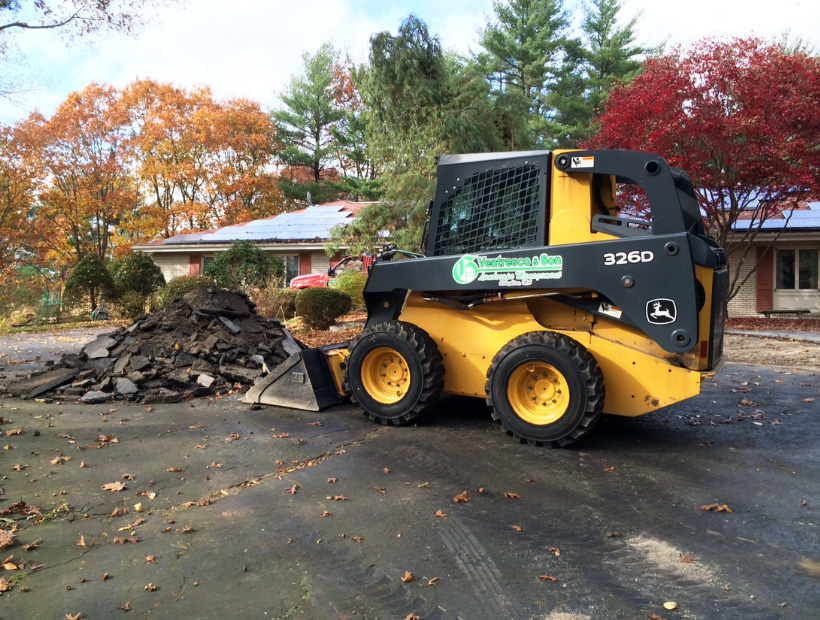 Bobcat ripping up Asphalt